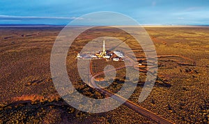 Aerial photo of hydraulic fracturing equipment at sunset. FRACKING