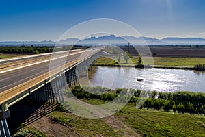 Aerial photo of I-10 Interstate over the Rio Grande with organ mountains in background