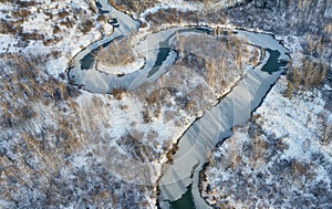 Aerial photo of Koen river under ice and snow. Beautiful winter landscape