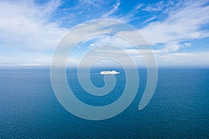 Aerial photo of a large ocean liner cruise ship in the ocean on a bright sunny summers day in on the coast