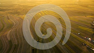 Aerial photo over yellow fields of Suloszowa village in Krakow County, Poland at sunset