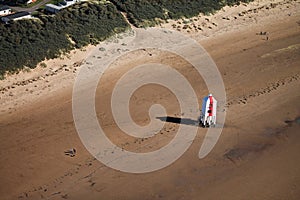 Aerial photo of red and white lighthouse on beach near Burnham on Sea, England