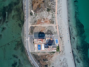 Aerial photo of residential complex and the beach on a natural spit of La Manga between the Mediterranean and the Mar Menor,