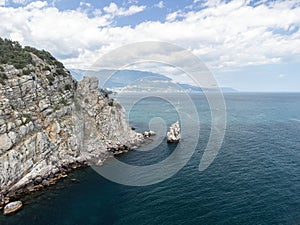 aerial photo of rock Parus Sail and Ayu-Dag Bear Mountain and near Gaspra, Yalta, Crimea at bright sunny day over