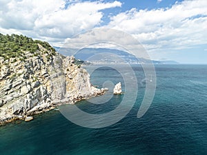 aerial photo of rock Parus Sail and Ayu-Dag Bear Mountain and near Gaspra, Yalta, Crimea at bright sunny day over