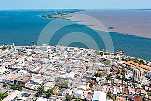 Aerial photo of SatarÃÂ©m City and the meeting of the waters of the Amazon Rivers with the TapajÃÂ³s River in ParÃÂ¡, Brazil. photo