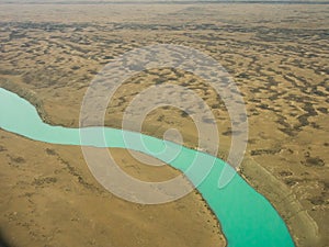 Aerial photo of sinuous, winding river with exotic colors