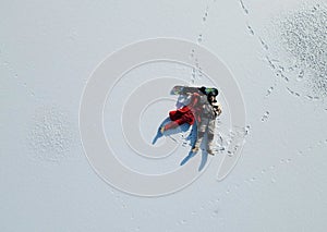 Aerial Photo Of Skier And Snowboarder Lying On Snow