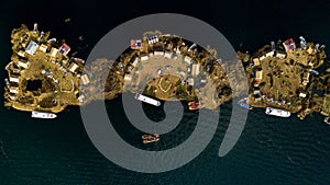 Aerial photo of three floating islands on Lake Titicaca in Peru