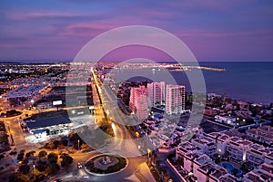 Aerial photo top view of Torrevieja spanish resort city during sunset purple violet colour cloudy sky