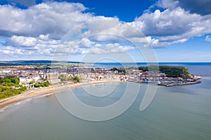 Aerial photo of the town centre of Scarborough in East Yorkshire in the UK showing the coastal beach and harbour with boats and