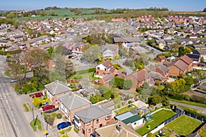 Aerial photo of the town of Kippax in Leeds West Yorkshire in the UK showing residential housing estates on a beautiful sunny