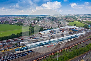 Aerial Photo of a train station works depot with lots of trains in the tracks located in the village of Halton Moor in Leeds, West