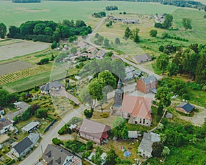Aerial photo of a typical Polish hosing estate in the mountains towns, taken on a sunny part cloudy day using a drone, showing the