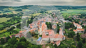 Aerial photo of a typical Polish hosing estate in the mountains towns, taken on a sunny part cloudy day using a drone, showing the