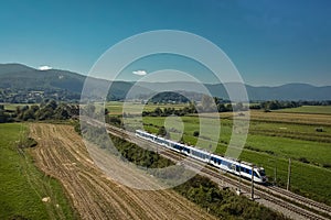 Aerial photo of white and blue train