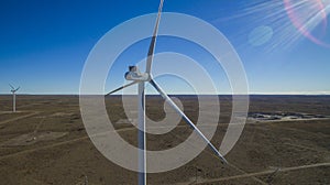 Aerial photo of windmills powered by aerofoil that provide sustainable energy.