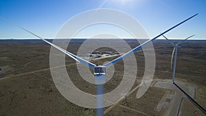 Aerial photo of windmills powered by aerofoil that provide sustainable energy.