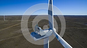 Aerial photo of windmills powered by aerofoil that provide sustainable energy.