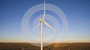 Aerial photo of windmills powered by aerofoil that provide sustainable energy.