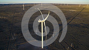 Aerial photo of windmills powered by aerofoil that provide sustainable energy.