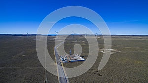 Aerial photo of windmills powered by aerofoil that provide sustainable energy.