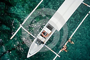 Aerial photo of young couple on holidays swimming in ocean