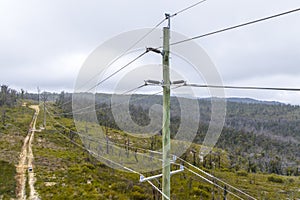 Aerial photograph of a wooden powerline pole and wires