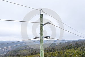 Aerial photograph of a wooden powerline pole and wires