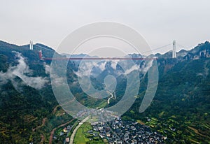 Aerial photography Aizhai Bridge over the clouds in Xiangxi, Hunan, China