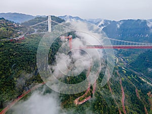 Aerial photography Aizhai Bridge over the clouds in Xiangxi, Hunan, China