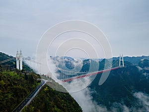 Aerial photography Aizhai Bridge over the clouds in Xiangxi, Hunan, China