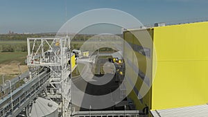 Aerial photography, a drone flew past the industrial workshop and hangars with grain. Agro-processing and production