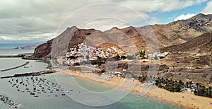 Aerial photography drone point of view of Playa de Las Teresitas beach picturesque distant view of mountainous terrain bright