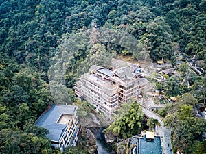 Aerial photography of forest mountain stream buildings in Longsheng, Guangxi, China