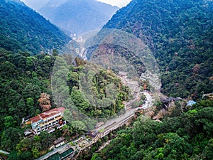 Aerial photography of forest mountain stream buildings in Longsheng, Guangxi, China