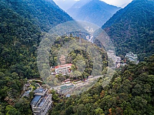 Aerial photography of forest mountain stream buildings in Longsheng, Guangxi, China