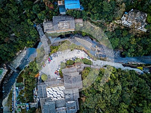 Aerial photography of forest mountain stream buildings in Longsheng, Guangxi, China