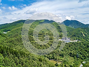 Aerial photography of magnificent scenery of blue sky and green mountains at Kunlun Pass in Nanning, Guangxi, China