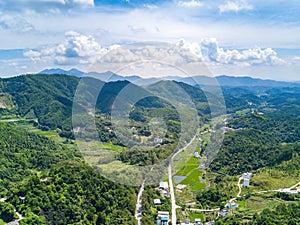 Aerial photography of magnificent scenery of blue sky and green mountains at Kunlun Pass in Nanning, Guangxi, China