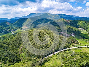 Aerial photography of magnificent scenery of blue sky and green mountains at Kunlun Pass in Nanning, Guangxi, China