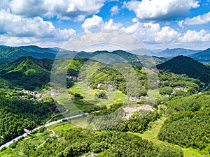 Aerial photography of magnificent scenery of blue sky and green mountains at Kunlun Pass in Nanning, Guangxi, China