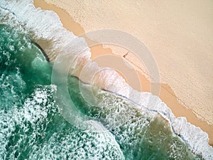 Aerial Photography of Ocean With Person Walking on Beach