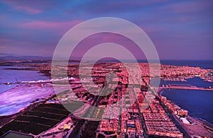 Aerial photography picturesque sunset over Torrevieja spanish resort town evening purple violet cloudy sky