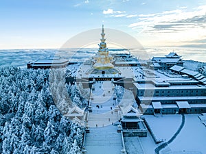 Aerial photography of snow covered Mount Emei in winter, the golden summit of Mount Emei in Sichuan