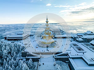 Aerial photography of snow covered Mount Emei in winter, the golden summit of Mount Emei in Sichuan(Huazang Temple)