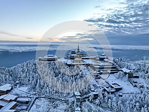 Aerial photography of snow covered Mount Emei in winter, the golden summit of Mount Emei in Sichuan(Huazang Temple)