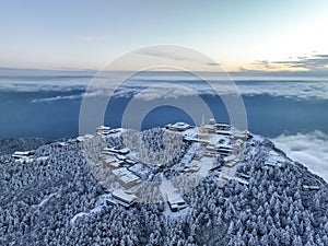 Aerial photography of snow covered Mount Emei in winter, the golden summit of Mount Emei in Sichuan(Huazang Temple)