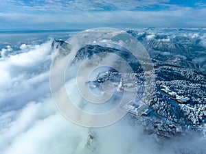 Aerial photography of snow covered Mount Emei in winter, the golden summit of Mount Emei in Sichuan(Huazang Temple)