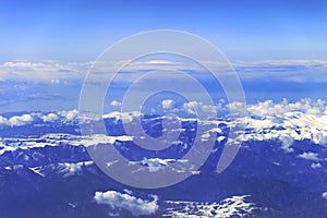 Aerial photography of the snow mountains and white cloud, adobe rgb